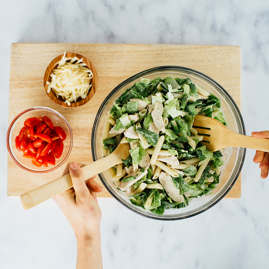 Chicken Caesar Penne Salad Step3 toss with dressing