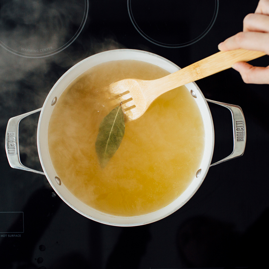 Classic Chicken Noodle Soup Step1 boil broth and bay leaves