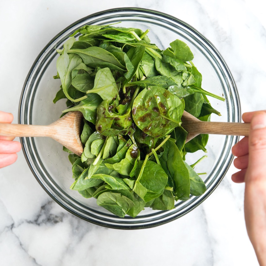 baby spinach tossed with dressing