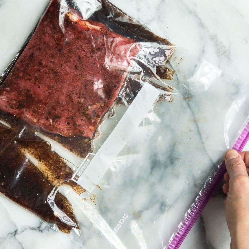 flank steak with marinade in bag