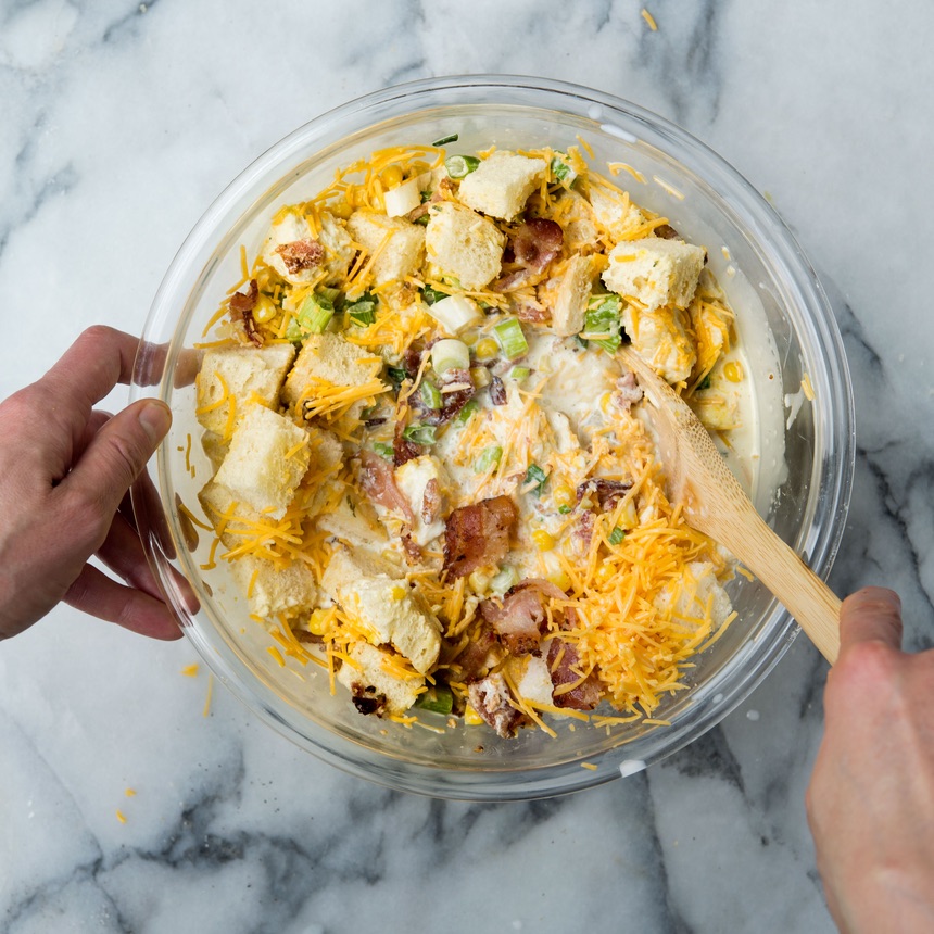 mixing toasts corn chilies bacon scallions cheese