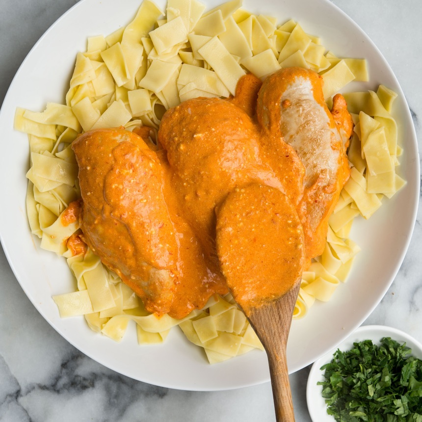 serve chicken over noodles