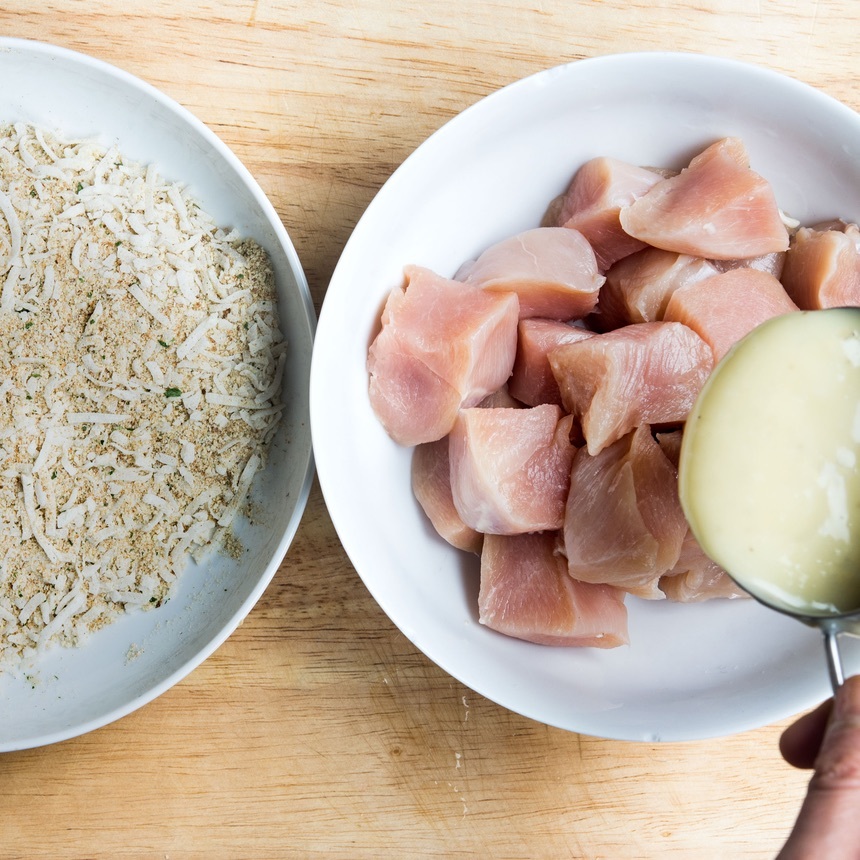 spoon dressing over chicken