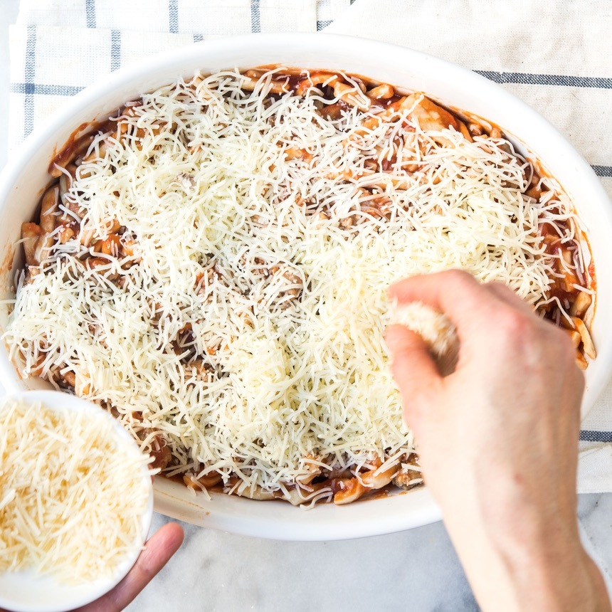 sprinkle cheese on pasta