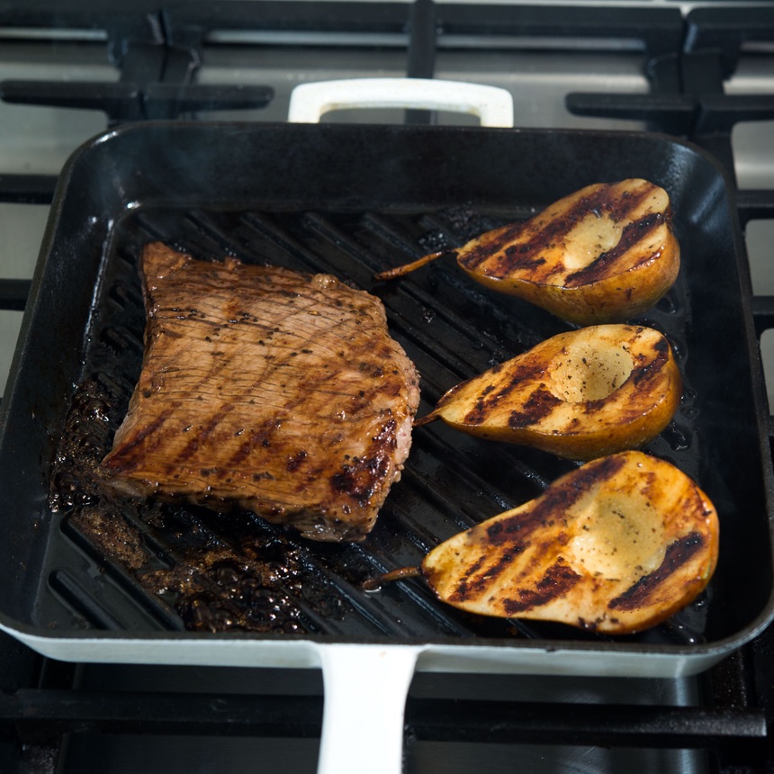 steak and pears on grill