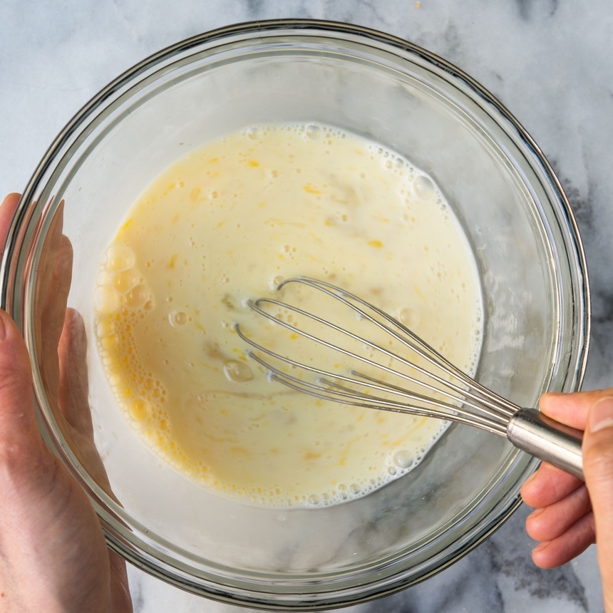 whisking eggs in bowl