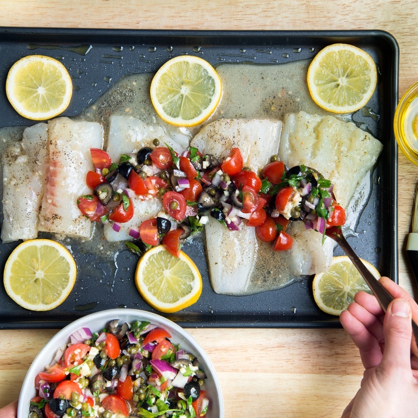 spoon mixture on fish