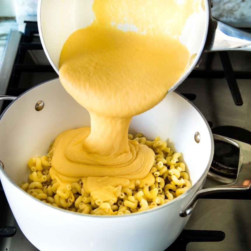 pour cheese on pasta