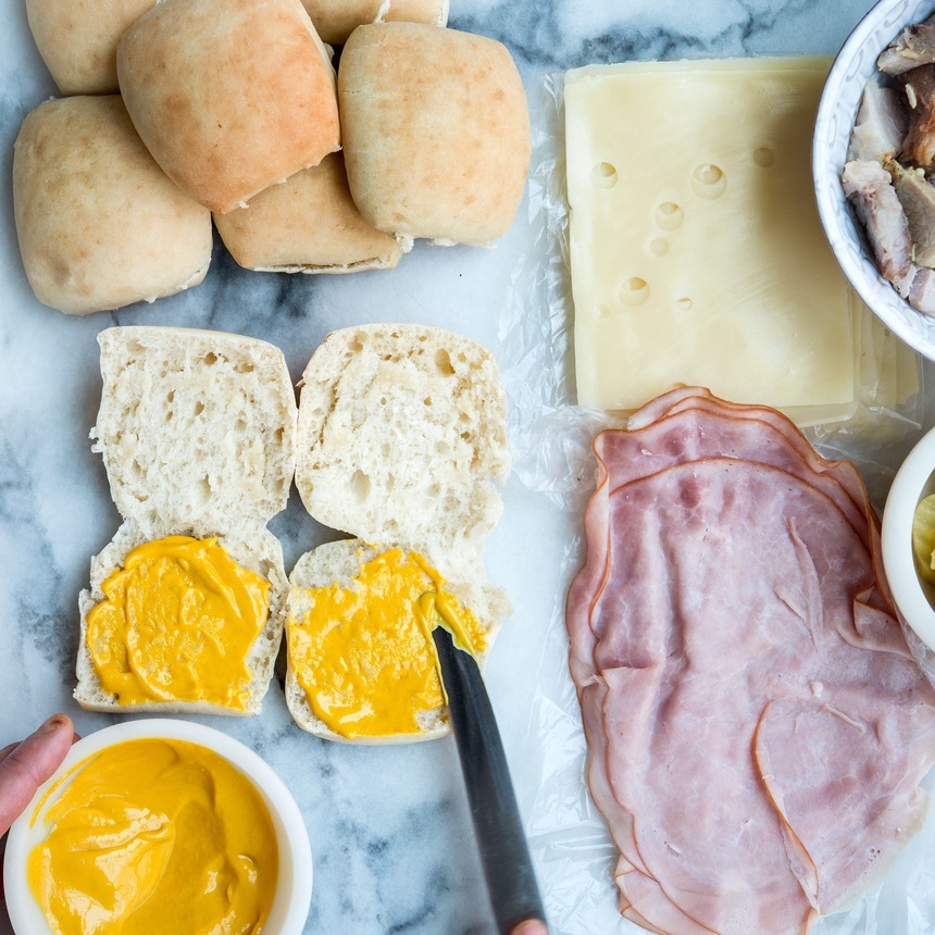 spread mustard on rolls