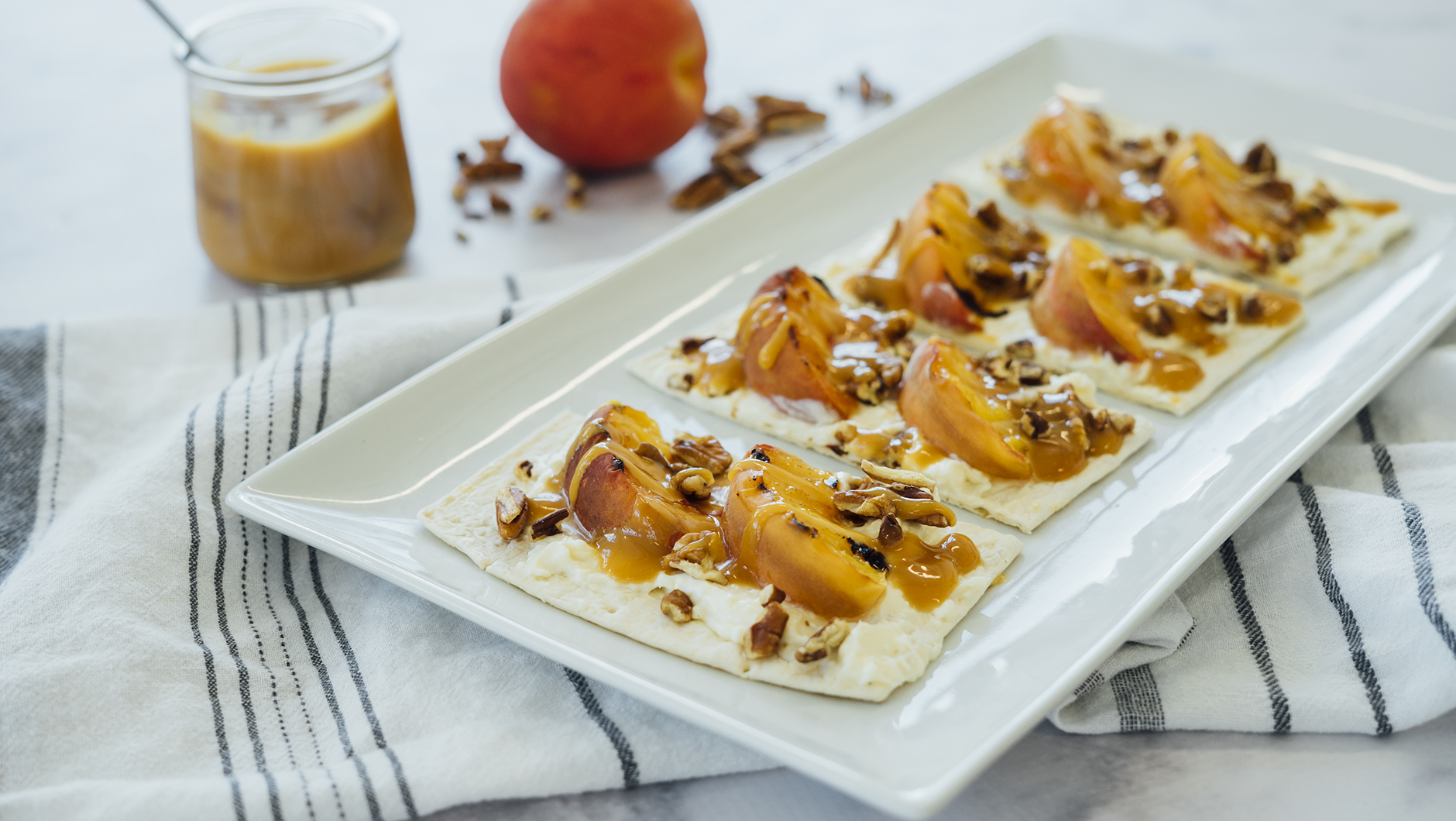 Grilled Peach and Caramel Dessert Pizza hero