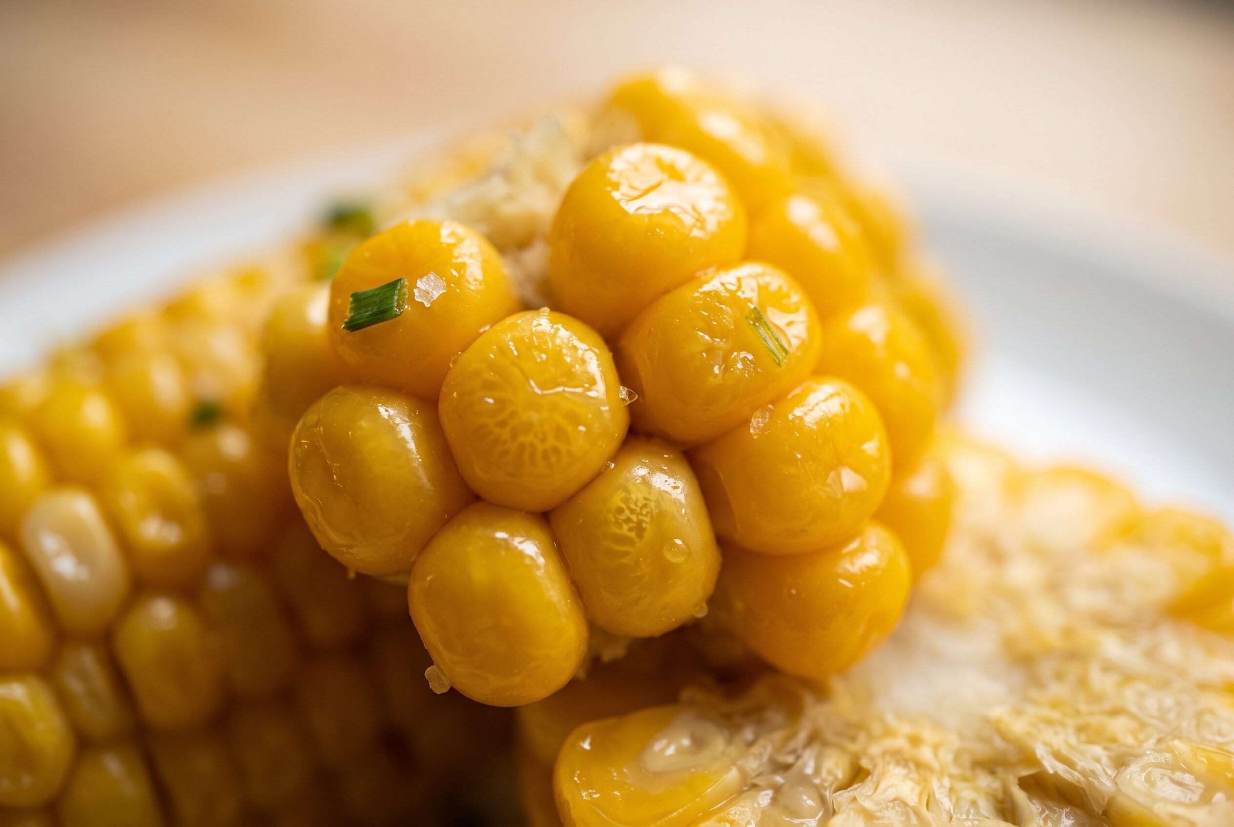 Close-up of plump, cooked yellow corn kernels