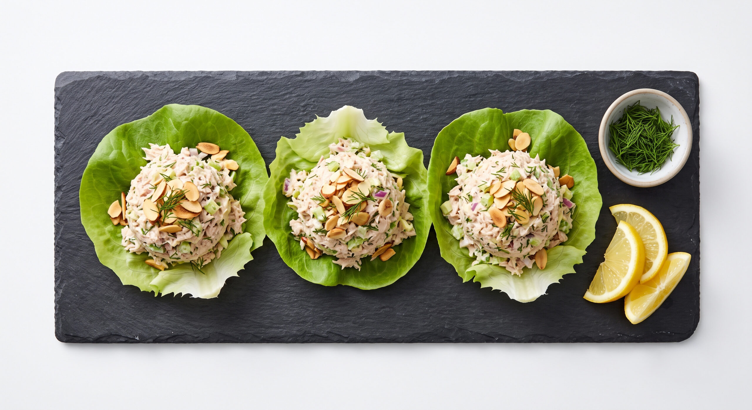 Tuna salad lettuce cups topped with almonds and dill